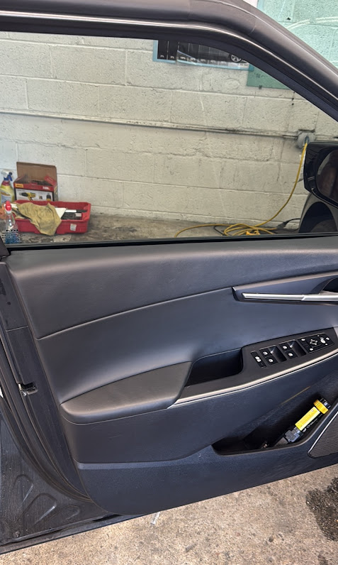 Interior view through tinted driver door window
